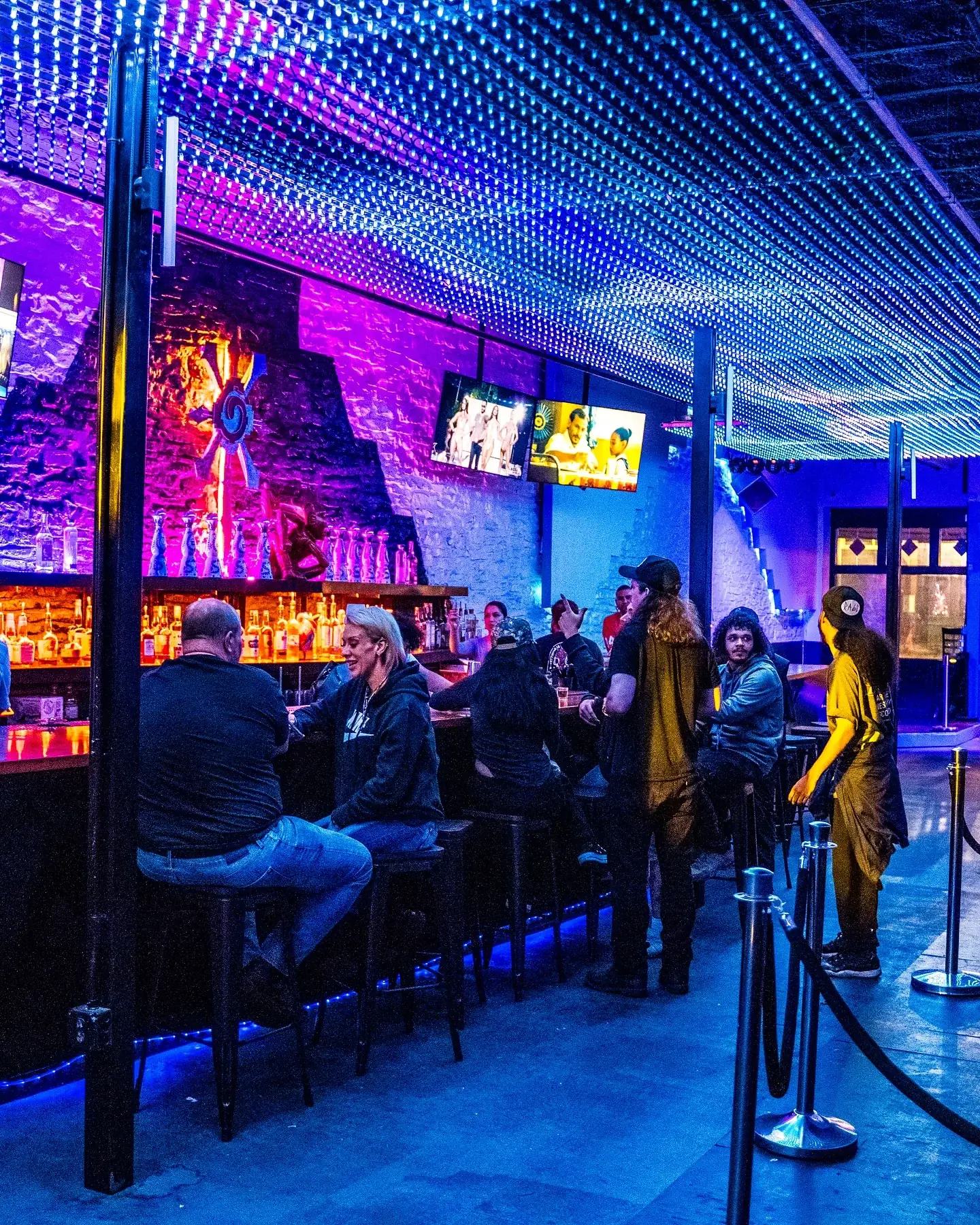Blindside Lounge interior on Sixth Street in Austin with blue and purple LED ceiling