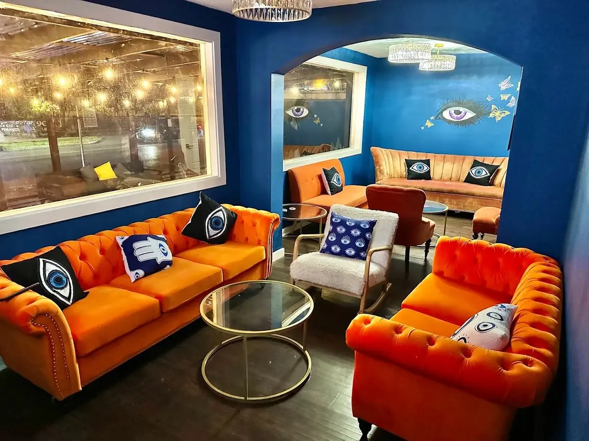 Private VIP room at Elsewhere Hookah Lounge with orange velvet sofas